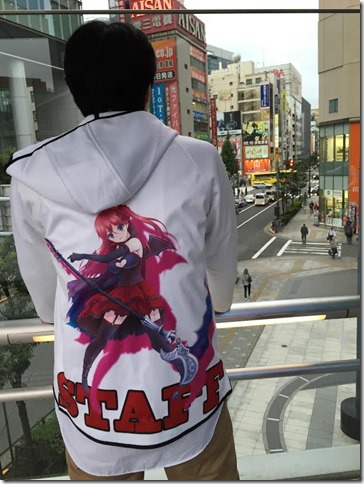 XERO’s Sugawara-san (Chief of Ads and Sales) overlooking the streets of Akihabara as he dons a special staff jacket featuring Lycoris.