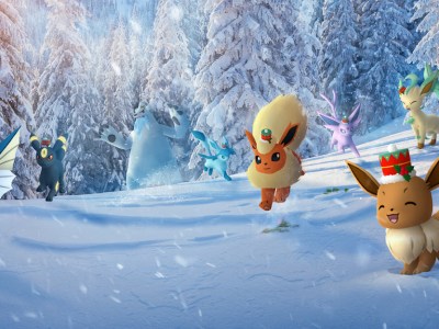 Key art of Eevee and its evolutions wearing holiday hats in the snow, with a Beartic in the background