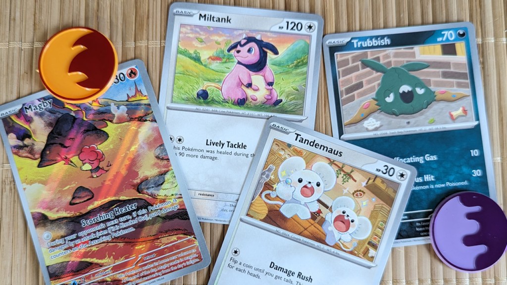 look at these cute pokemon cards, it's magby and miltank and tandemaus and trubbish