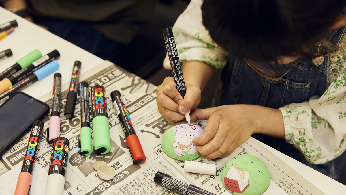 Poke Ball design workshop at Tama Art University Bureau - Japanese grade school student drawing a Slowpoke ball