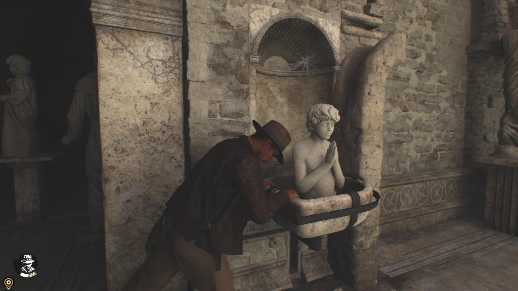 Indiana Jones pushing a statue of a child in a basin during The Baptism puzzle