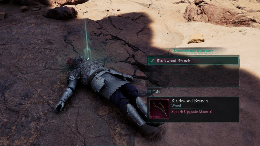 Picking up an upgrade material from the body of an enemy in Avowed