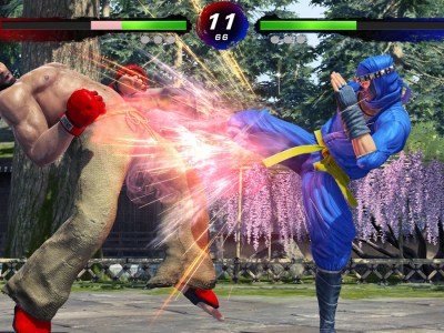 Virtua Fighter 5 R.E.V.O. - A ninja kicks a man off the ground.