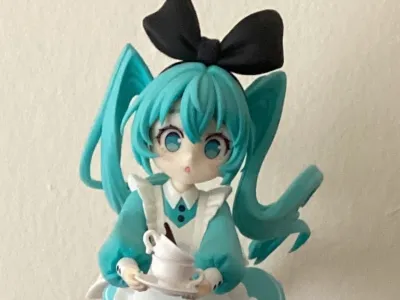 The Hatsune Miku Desktop Fairy Wonderland figure is fun because of the hurried element of her dynamic pose and Alice in Wonderland design.